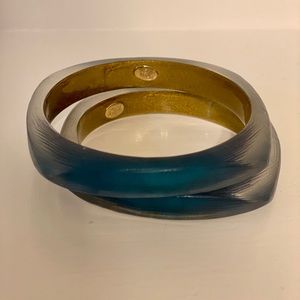 Two Alexis Bittar lucite Soft Square bangles.
